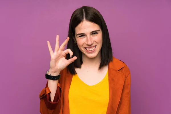 Young Woman Coat Isolated Purple Background Showing Sign Fingers — Stock Photo, Image
