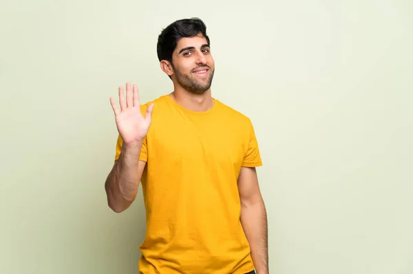 Young Man Pink Wall Saluting Hand Happy Expression — Stock Photo, Image