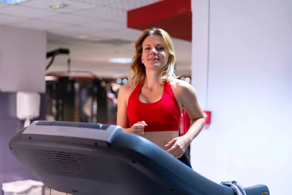 Woman in a gym  running fast running