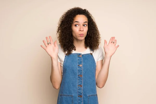 Dominican Woman Overalls Making Doubts Gesture — Stock Photo, Image