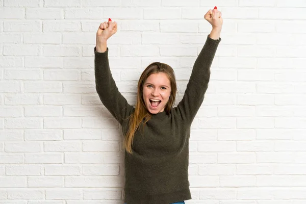 Young Woman White Brick Wall Celebrating Victory — Stock Photo, Image