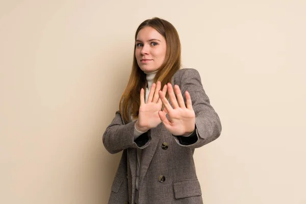 Young business woman nervous stretching hands to the front