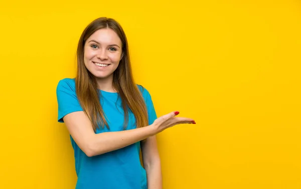 Young Woman Blue Shirt Extending Hands Side Inviting Come — Stock Photo, Image