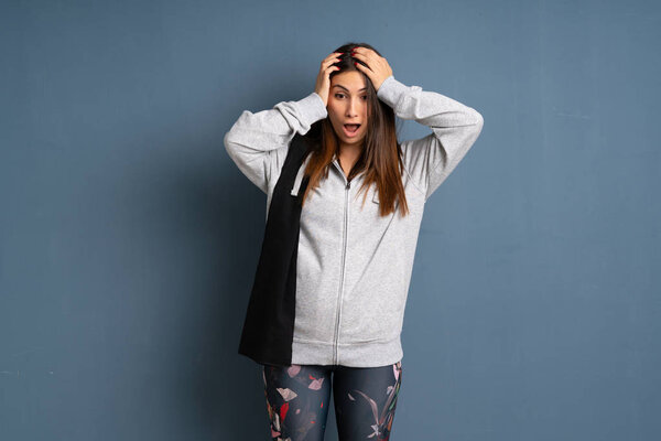 Young sport woman with surprise expression