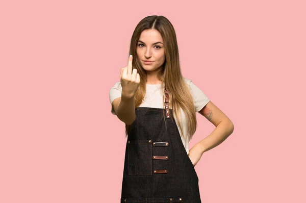 Young Woman Apron Making Horn Gesture Isolated Pink Background — 스톡 사진