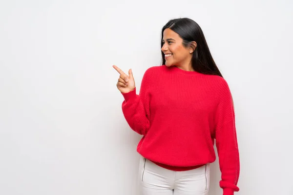 Young Colombian Girl Red Sweater Pointing Finger Side — 스톡 사진