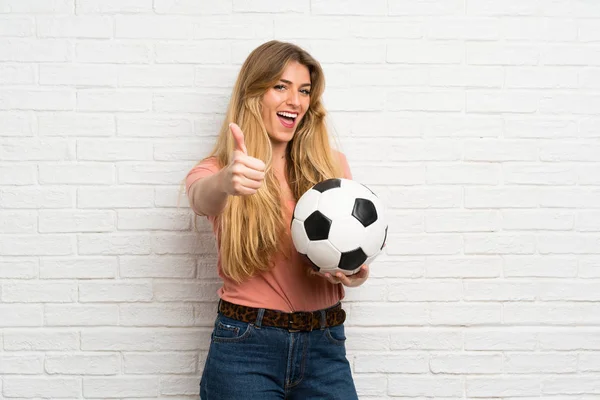 Young Blonde Woman White Brick Wall Holding Soccer Ball — Stock Photo, Image