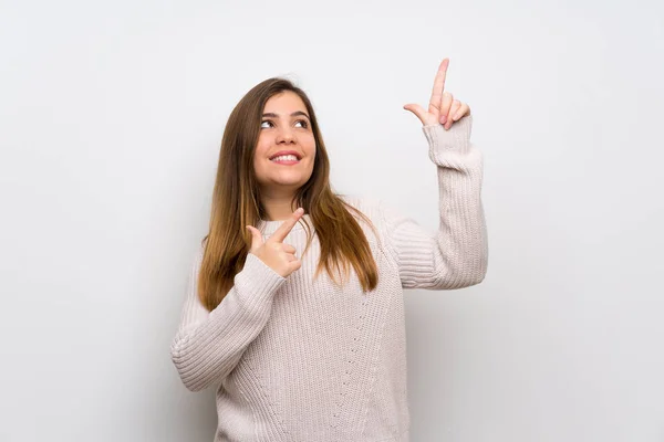 Chica Joven Con Suéter Blanco Señalando Con Dedo Índice Una — Foto de Stock