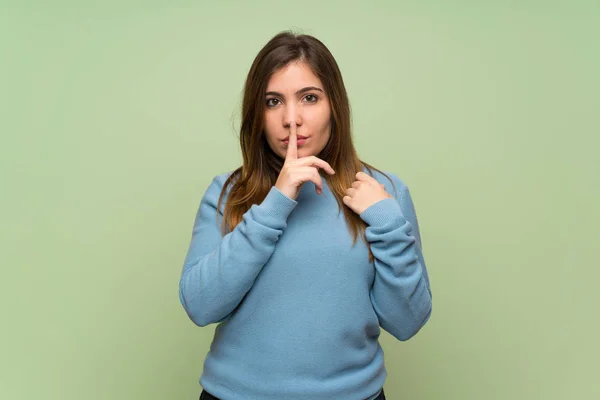 Young Girl Green Wall Showing Sign Silence Gesture Putting Finger — Stockfoto