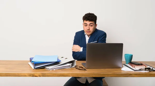 Business man in a office freezing