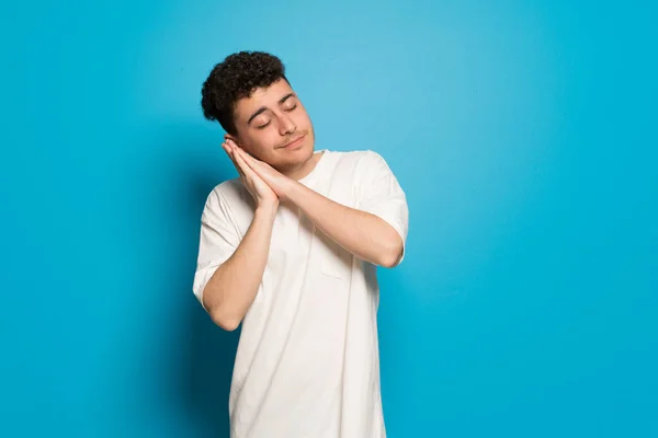 Young Man Blue Background Making Sleep Gesture Dorable Expression — 스톡 사진
