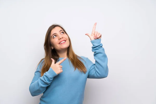 Young Girl Blue Sweater Pointing Index Finger Great Idea — Stock Photo, Image