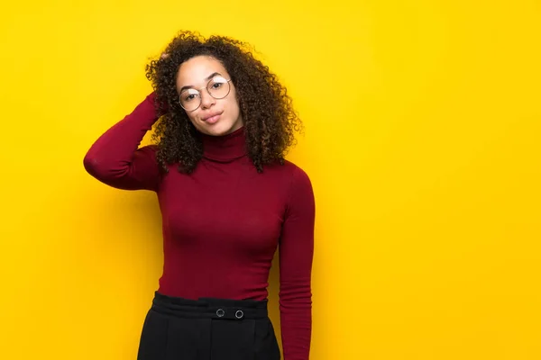 Dominican woman with turtleneck sweater with an expression of frustration and not understanding