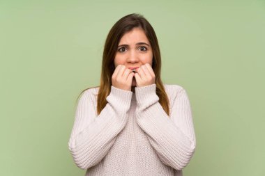 Young girl with white sweater nervous and scared
