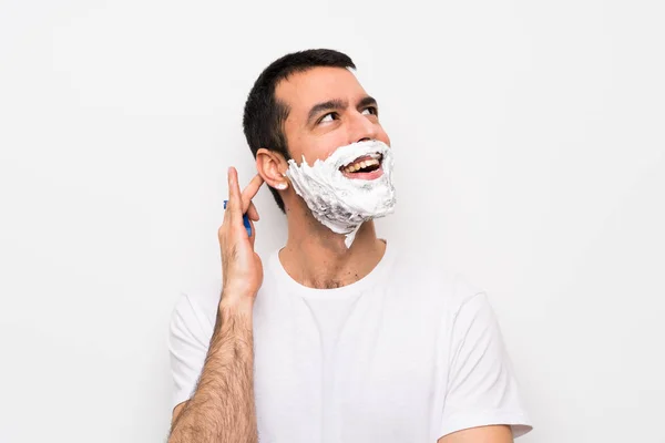 Hombre Afeitándose Barba Sobre Fondo Blanco Aislado Pensando Una Idea —  Fotos de Stock