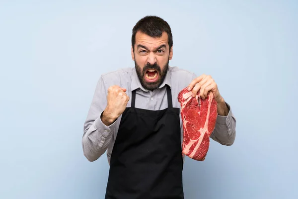 Chef holding a raw meat frustrated by a bad situation