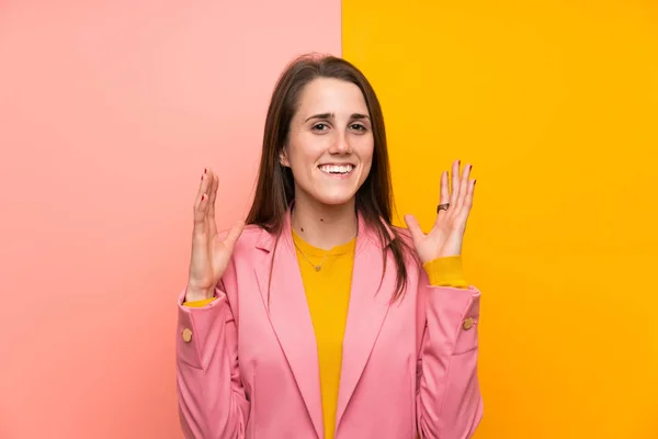 Young Woman Pink Suit Colorful Background Laughing — Zdjęcie stockowe