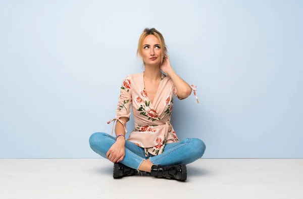 Young Blonde Woman Sitting Floor Having Doubts — 스톡 사진