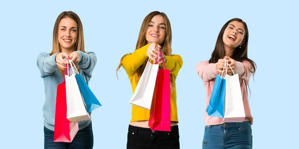 Group People Colorful Clothes Holding Lot Shopping Bags Colorful Background — Stock Photo, Image