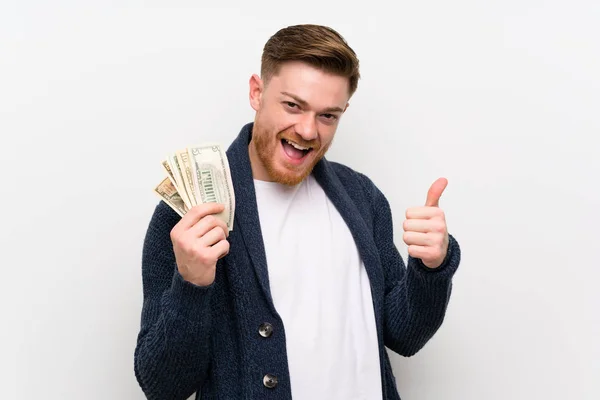 Vöröshajú férfi vesz egy csomó pénzt — Stock Fotó