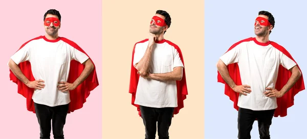 Set of Superhero man with mask and red cape standing and thinking an idea while looking up on colorful background