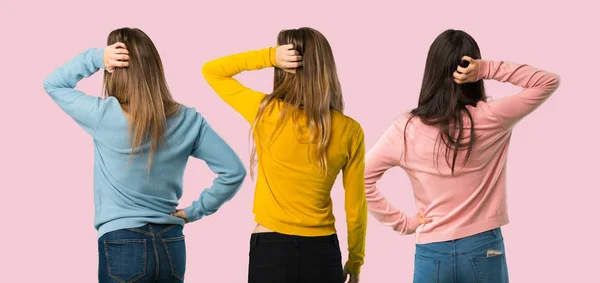 Group People Colorful Clothes Back Position Looking Back While Scratching — Stock Photo, Image