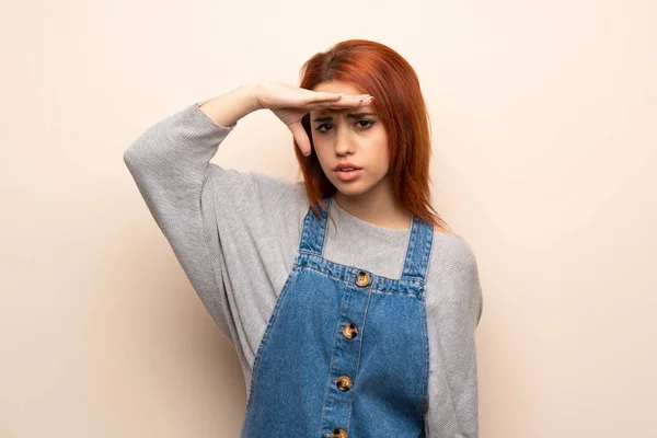 Young Redhead Woman Isolated Background Looking Far Away Hand Look — 스톡 사진