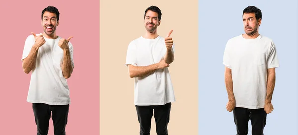 Молодой человек в белой рубашке, показывающий большой палец вверх жестом, и — стоковое фото