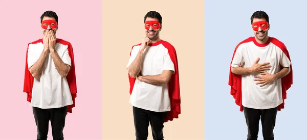 Set of Superhero man with mask and red cape smiling with a sweet expression on colorful background