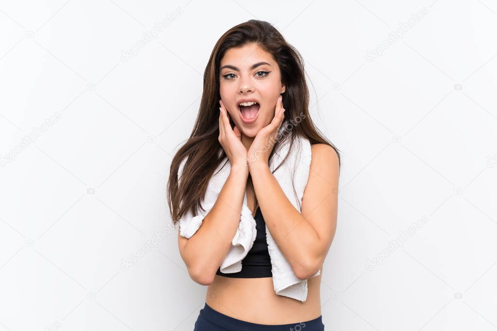 Teenager sport girl over isolated white background with surprise facial expression