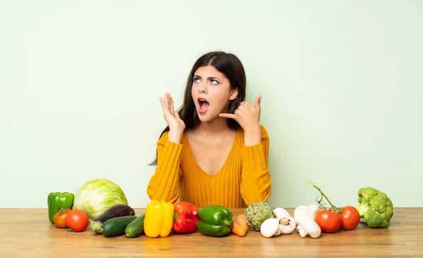 Teenager Girl Many Vegetables Making Phone Gesture Doubting — Stock Photo, Image