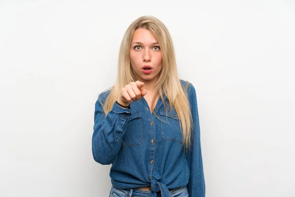 Young Blonde Woman Isolated White Wall Surprised Pointing Front — Stock Photo, Image