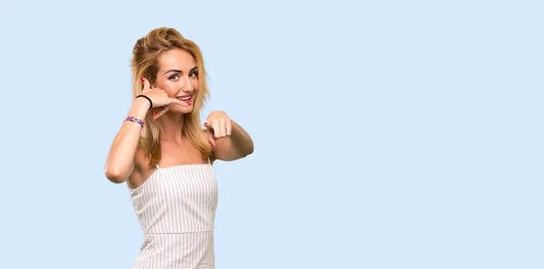 Young Blonde Woman Making Phone Gesture Pointing Front Isolated Blue — 스톡 사진