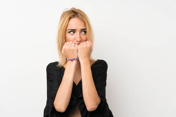 Young Blonde Woman Isolated White Wall Nervous Scared Putting Hands — Stock fotografie