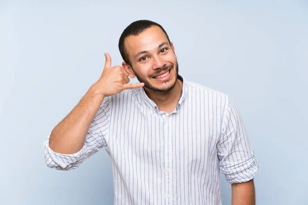 Colombian Man Isolated Blue Wall Making Phone Gesture Call Back — Stock Photo, Image