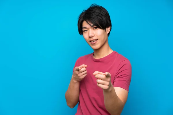 Asian Man Red Shirt Isolated Blue Wall Points Finger You — Stock Photo, Image