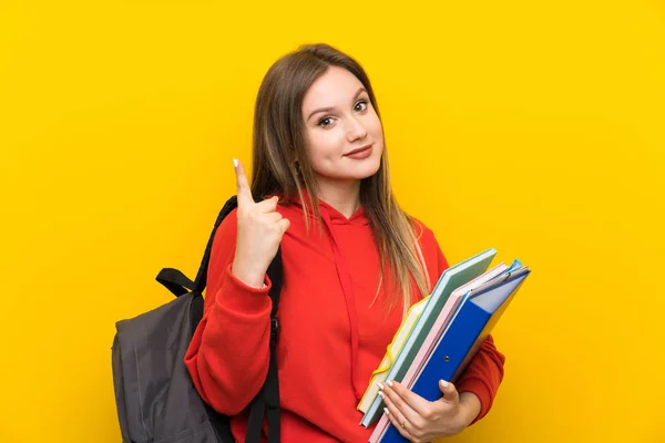 Teenager Student Girl Yellow Background Pointing Index Finger Great Idea — Stock Photo, Image