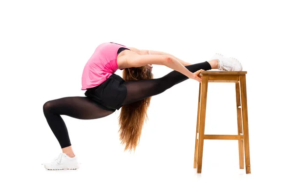 Joven danza chica sobre aislado blanco fondo estiramiento —  Fotos de Stock