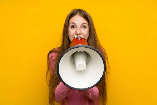 Young Woman Long Hair Isolated Yellow Wall Shouting Megaphone — Stock Photo, Image