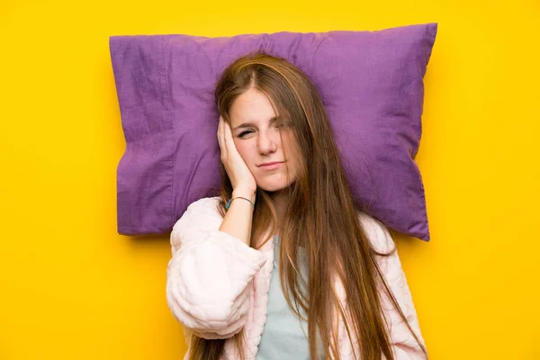 Young woman in dressing gown in a bed stressed