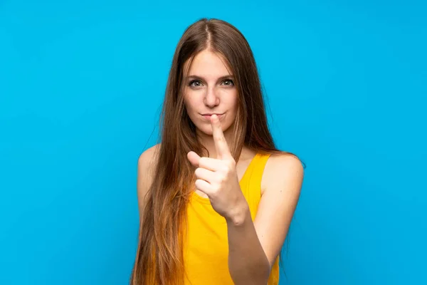 Young Woman Long Hair Isolated Blue Wall Frustrated Pointing Front — Stockfoto