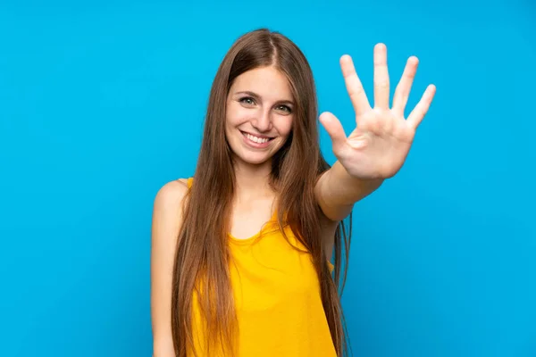 Young Woman Long Hair Isolated Blue Wall Counting Five Fingers — 스톡 사진