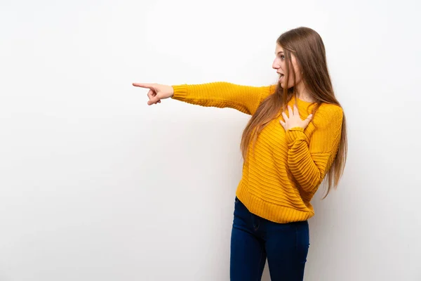 Young Woman Yellow Isolated White Wall Pointing Finger Side — 스톡 사진