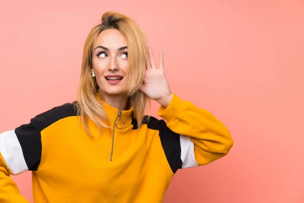 Young Blonde Woman Isolated Pink Background Listening Something Putting Hand — Stock Photo, Image