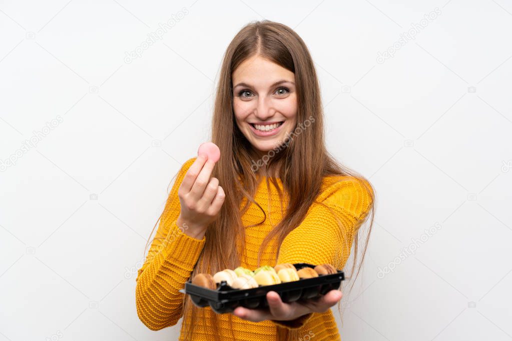 Young woman with long hair with macaroons