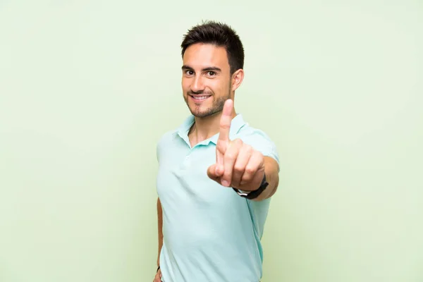 Handsome Young Man Isolated Background Showing Lifting Finger — Stock Photo, Image