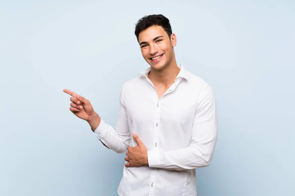 Handsome Man Blue Wall Pointing Finger Side — Stock Photo, Image