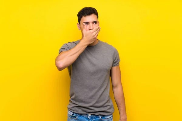 Handsome Man Isolated Yellow Wall Covering Mouth Hands — Stock Photo, Image