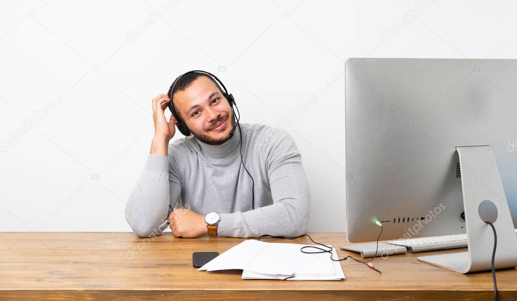 Telemarketer Colombian man with an expression of frustration and not understanding