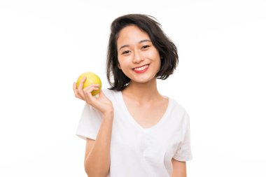 Bir elma ile izole arka plan üzerinde Asya genç kadın